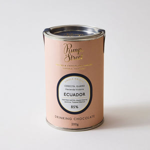 Pink tin of drinking chocolate on white background