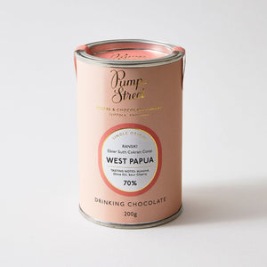 Pink tin of drinking chocolate on a plain white background