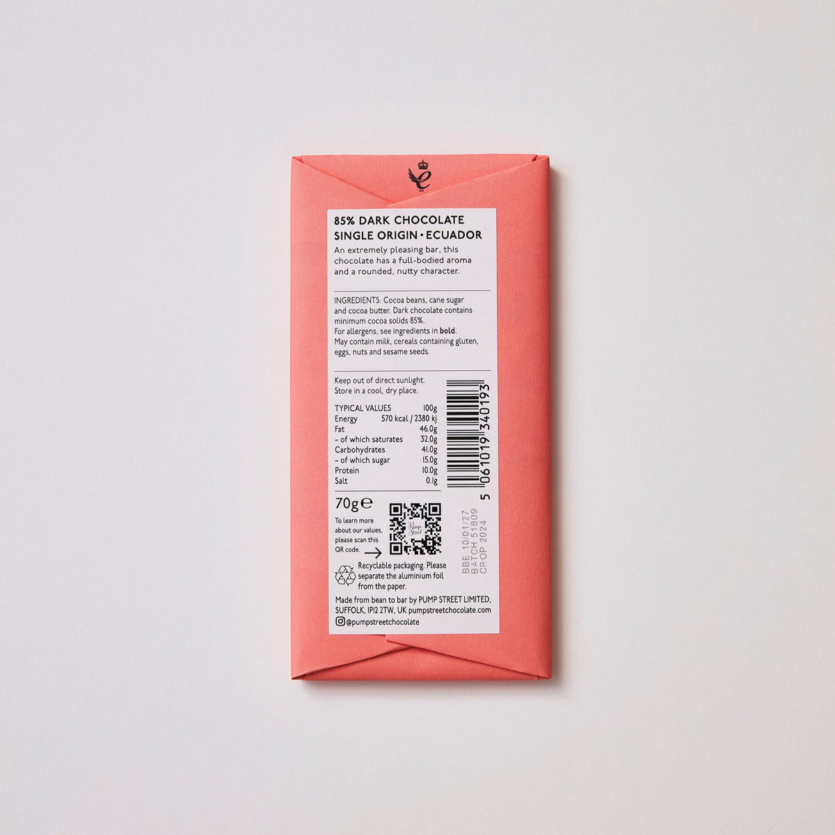 Chocolate bar packaging with text and a QR code on a light gray background