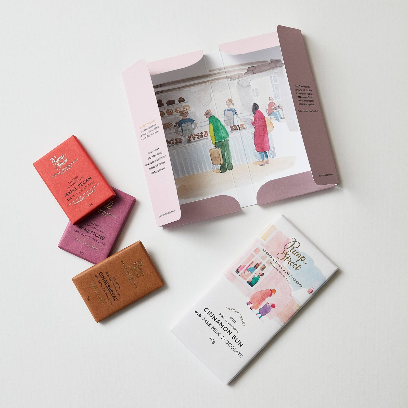 Pink chocolate tasting box with text on a white background