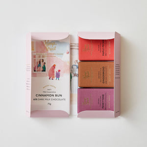 Chocolate bars in a pink packaging box on a white background