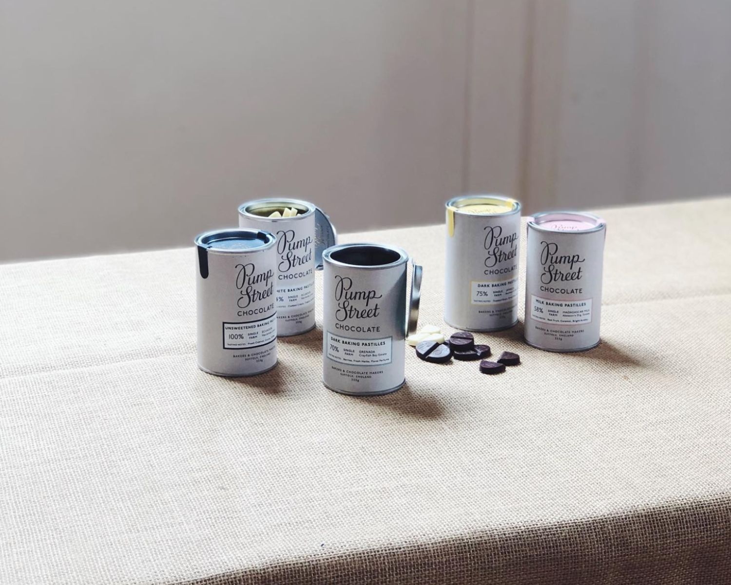 An assortment of Pump Street Tins full of Baking Chocolate Pastilles